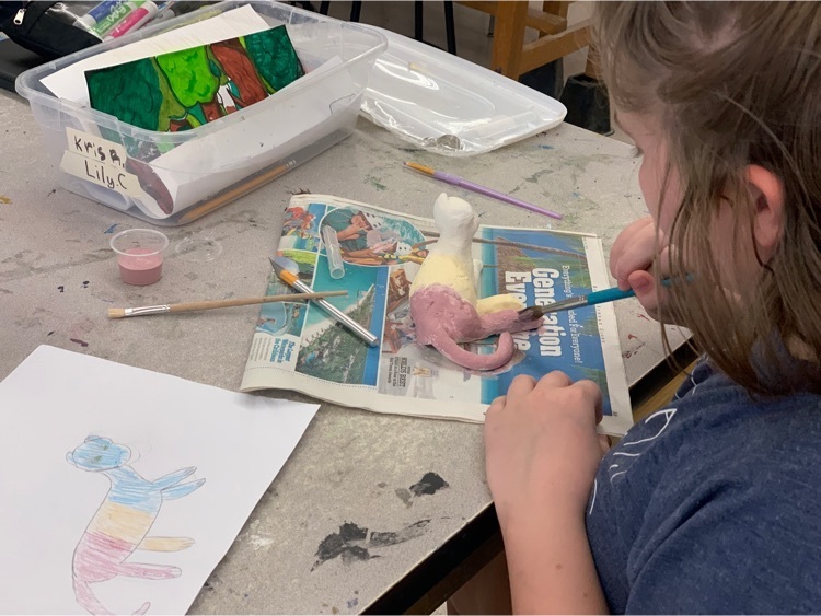 Students paints their artwork  