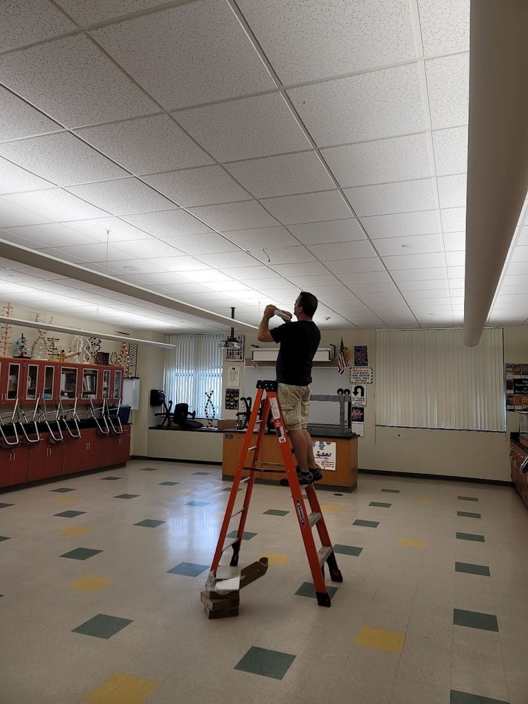 Greg Moquin from the tech department hanging access points