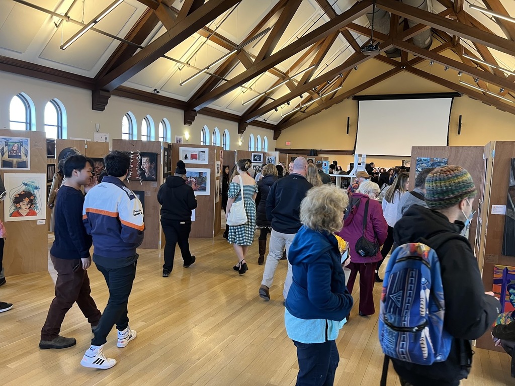 Folks visiting Leah's artwork at Tuft's University